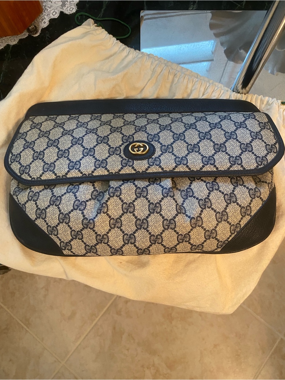 Vintage Gucci clutch with navy monogram